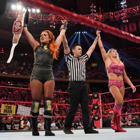 Becky Lynch holding Women Chamiponship title